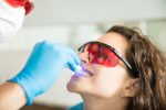 a lady is getting gum disease treatment